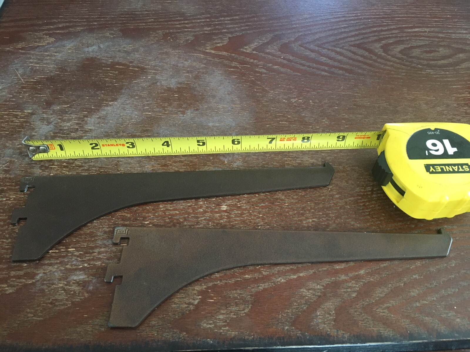 2 brown metal shelf support arms 8" after Slotted.