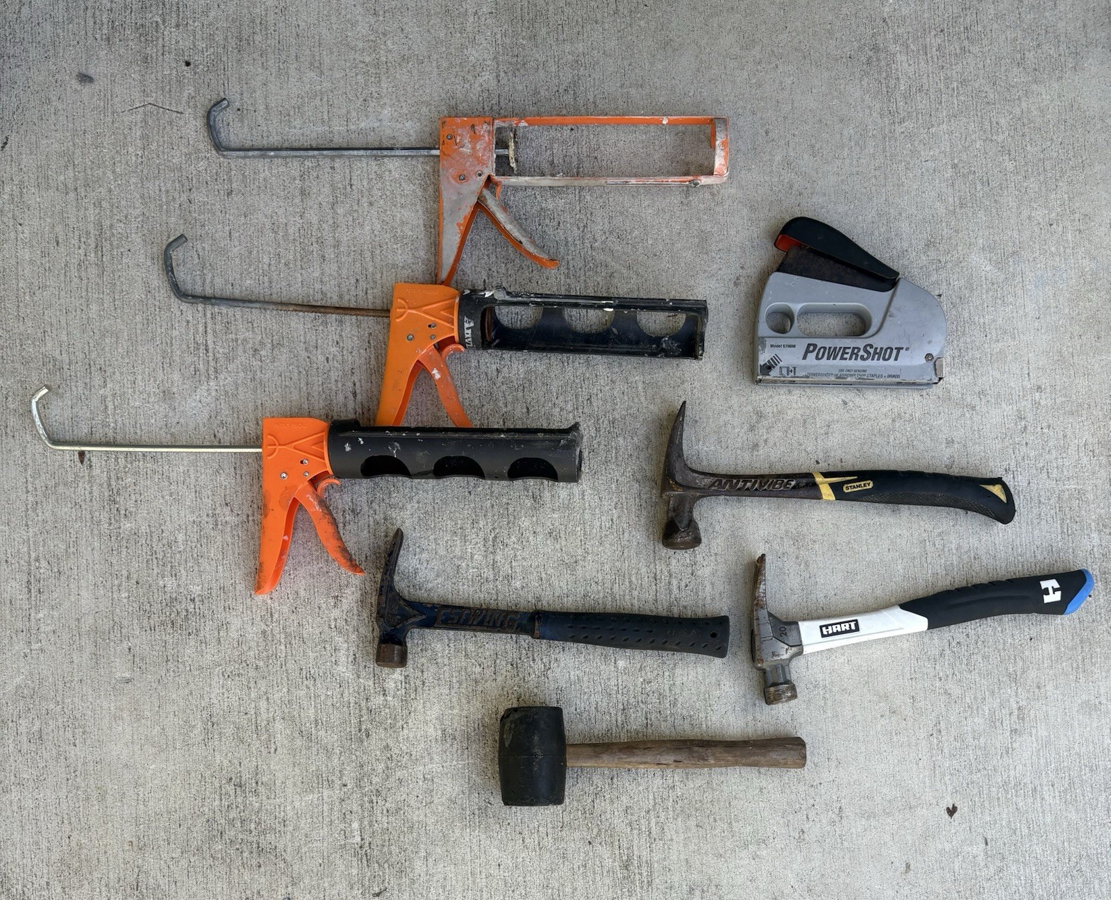 3 Hammers, 1 Mallet And 3 Caulk Guns