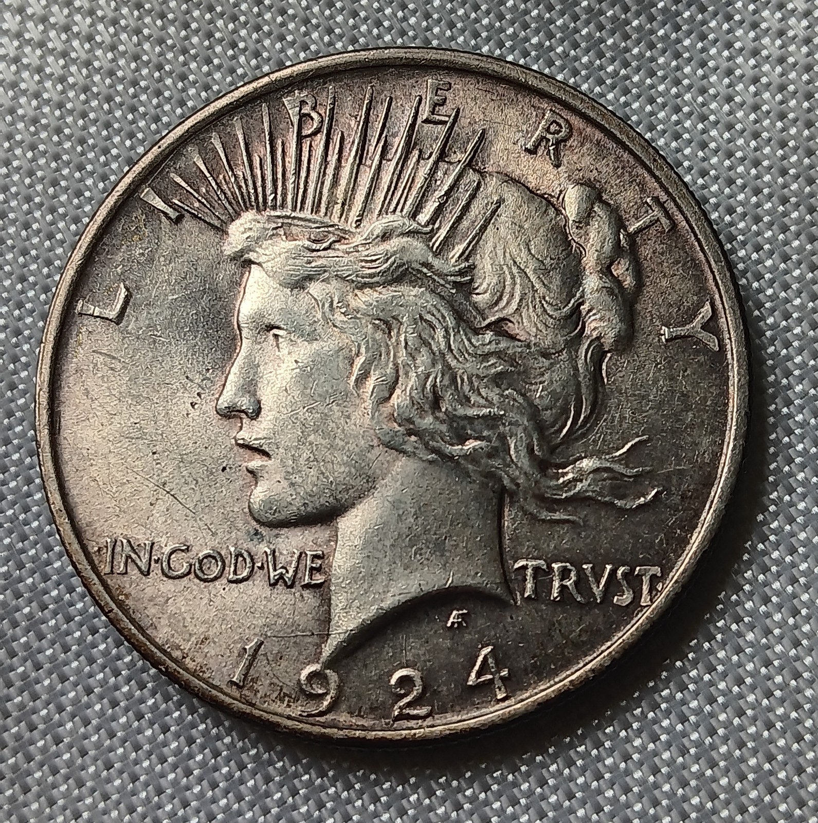 1924 peace silver dollar (Natural Toning)