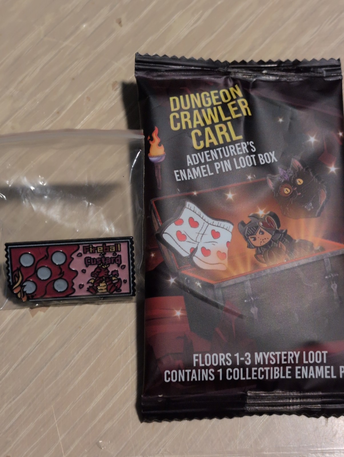 Dungeon Crawler Carl Enamel Pin – Foam Brain Games – Fireball or Custard