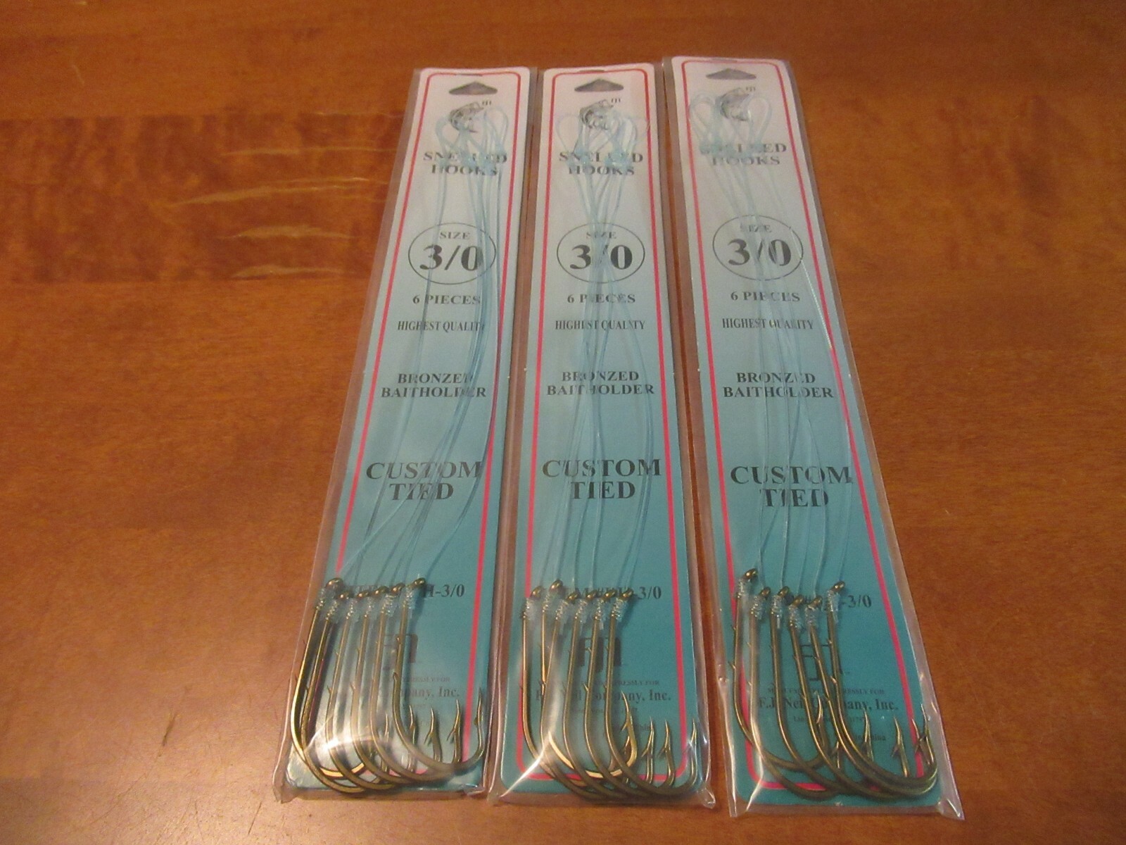 18 SNELLED FISH HOOKS (3 PKS X 6 EA)  BRONZE BAIT HOLDER MONO LEADER 7" PICK SZ