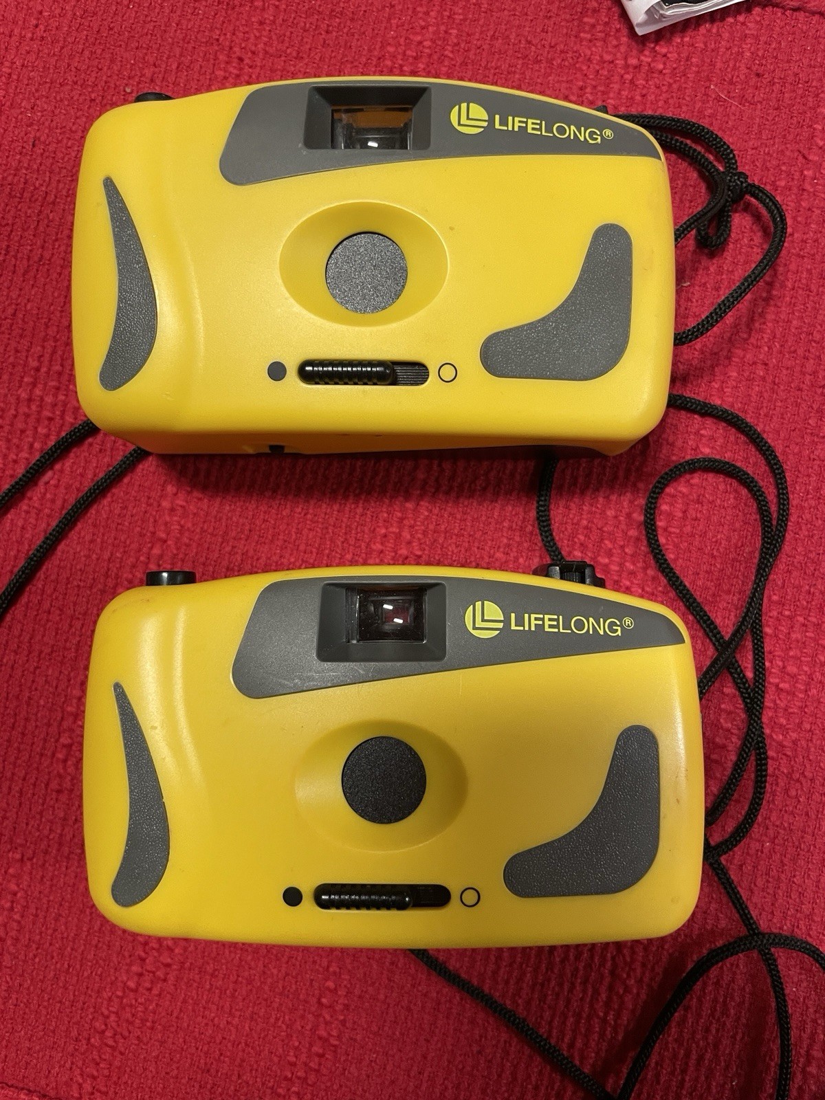 (1) LIFELONG yellow point and shoot 35 mm camera w/carry cord