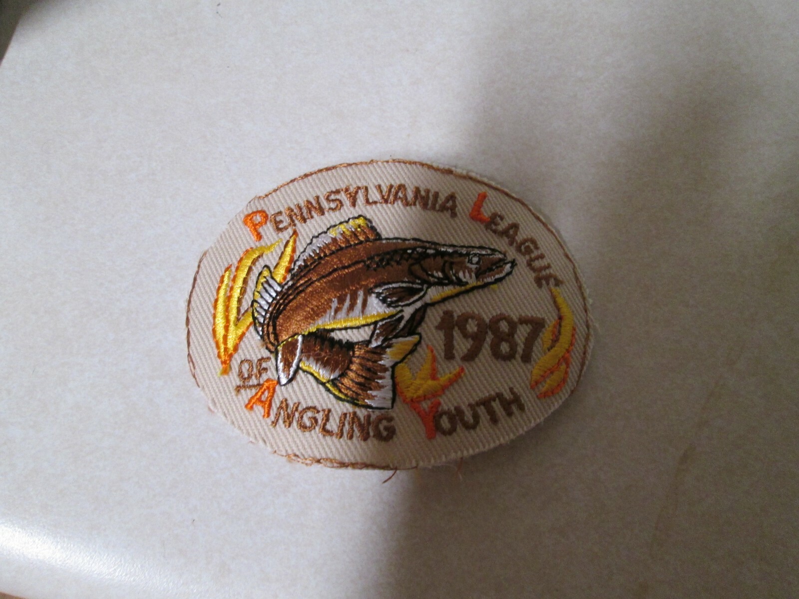 PATCH OLDER SEW ON PENNSYLVANIA LEAGUE OF ANGELING YOUTH 1987