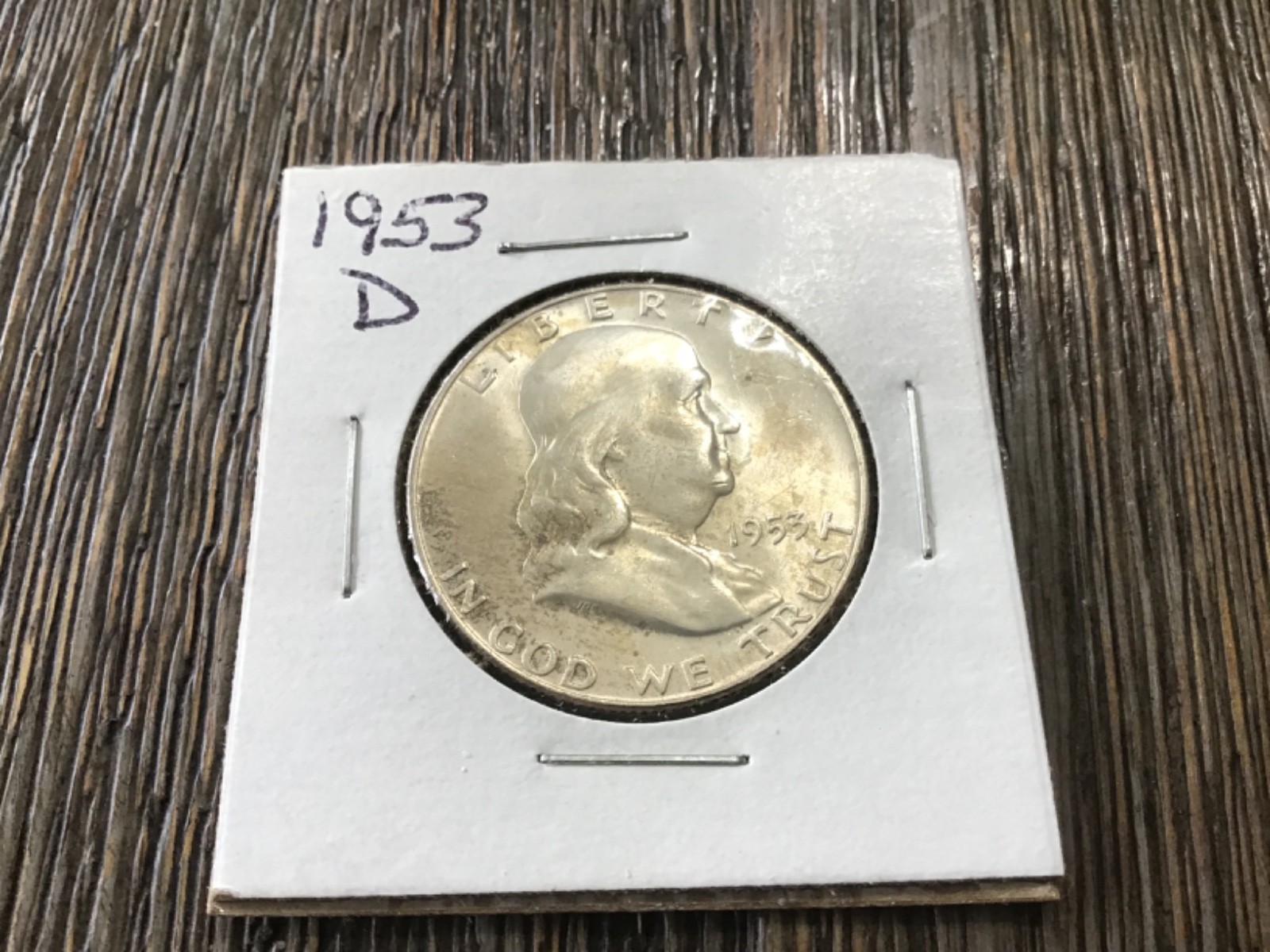 1953 s silver Franklin half dollar.