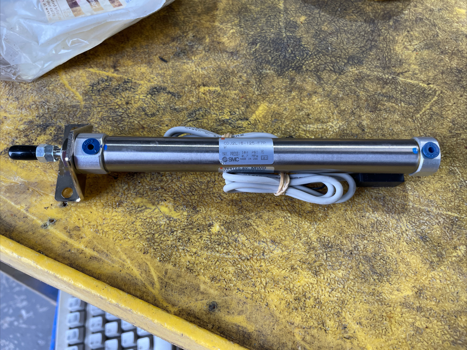SMC CDJ2L16-125-F7PW Pneumatic Cylinder with switches.