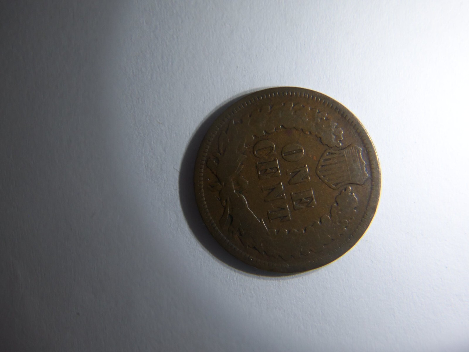 A KEY 1875 INDIAN HEAD PENNY