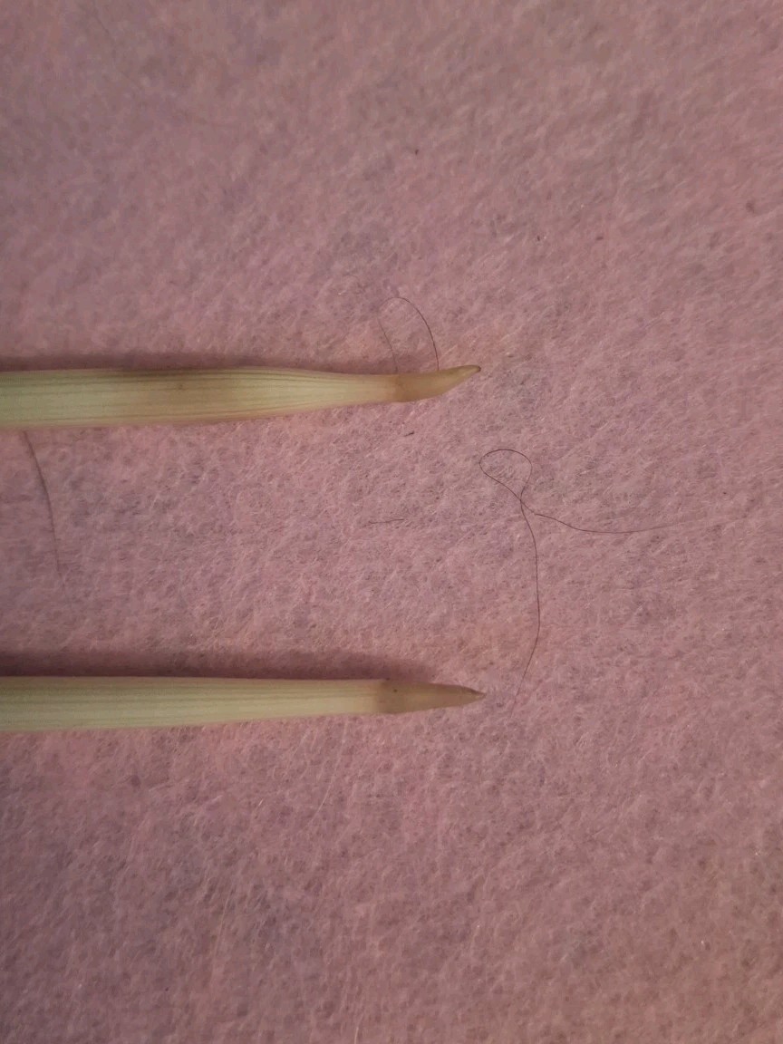TWO HANDCRAFTED PORCUPINE QUILL FLOATS