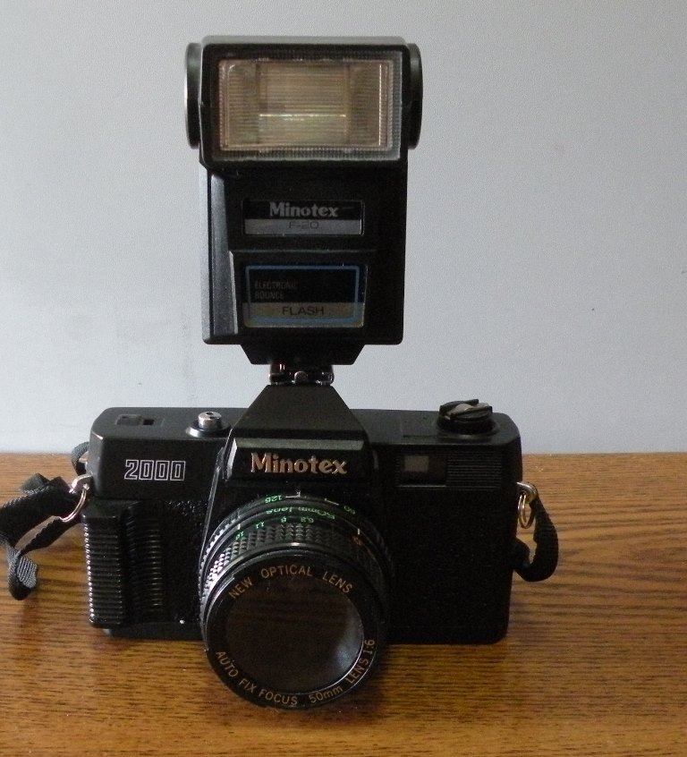 Minotex 2000 35MM camera with flash attachment and case in original box