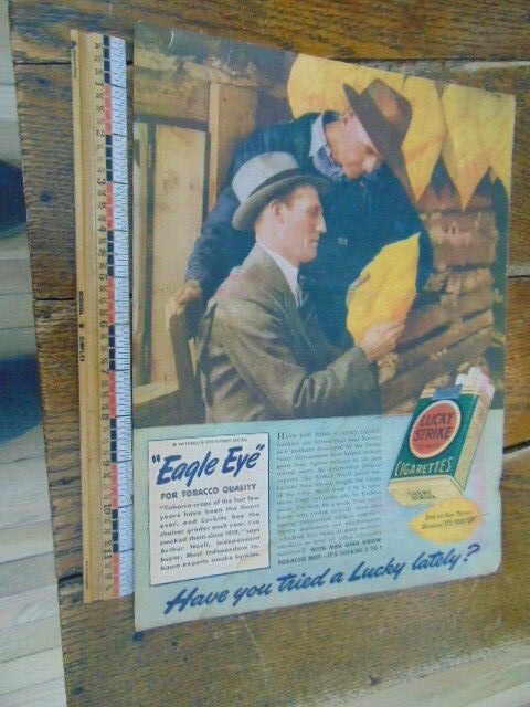 1939 Lucky Strike Cigarettes magazine advert- "Eagle Eye"- It's Toasted
