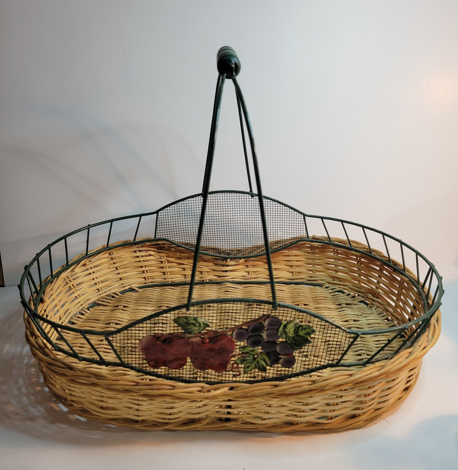 Oval basket with a Metal Frame, Decorative Metal Fruit Design & Handle