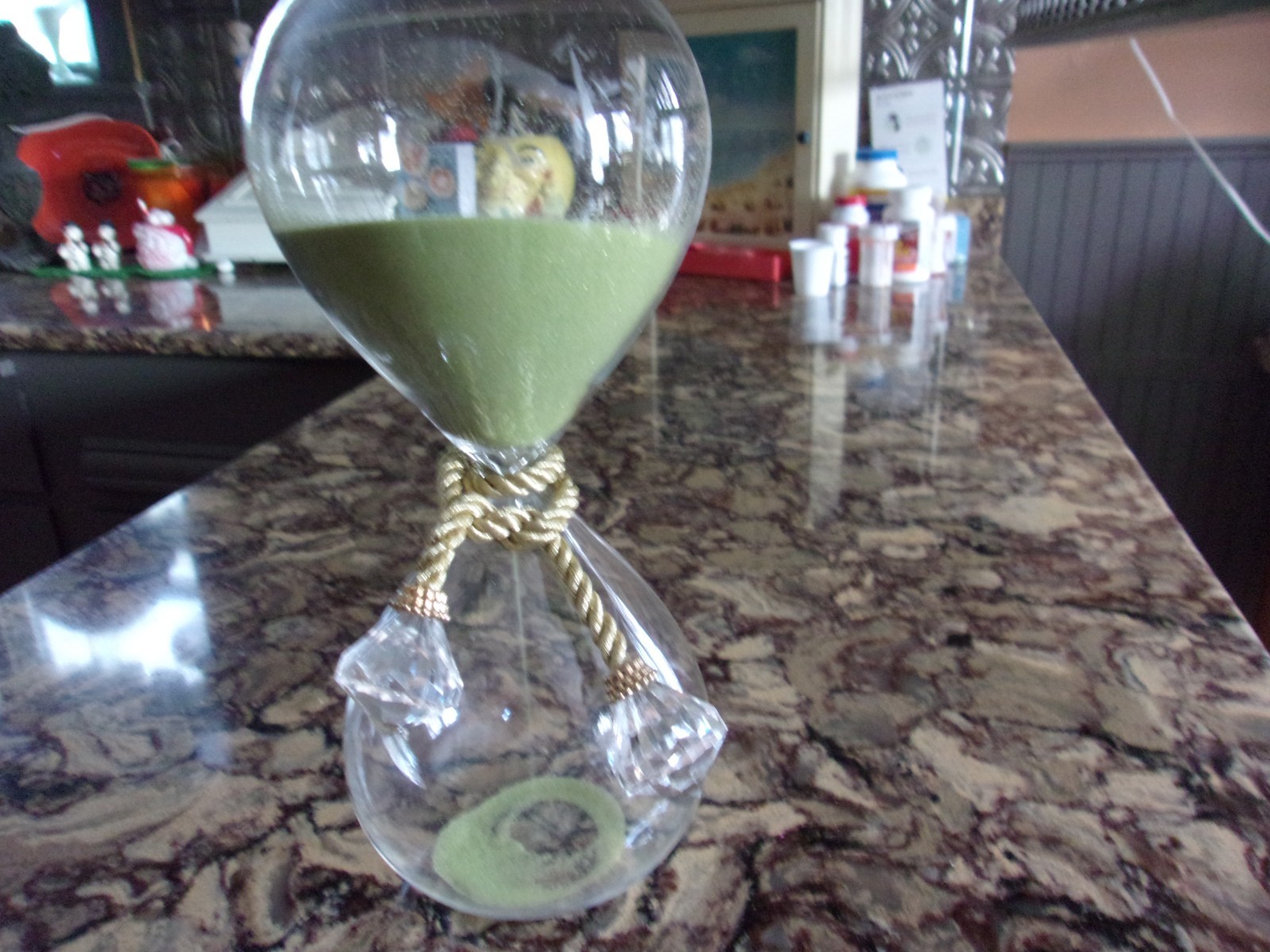 timer-huge glass pc. with greensand inside.faux crystal rope tie.