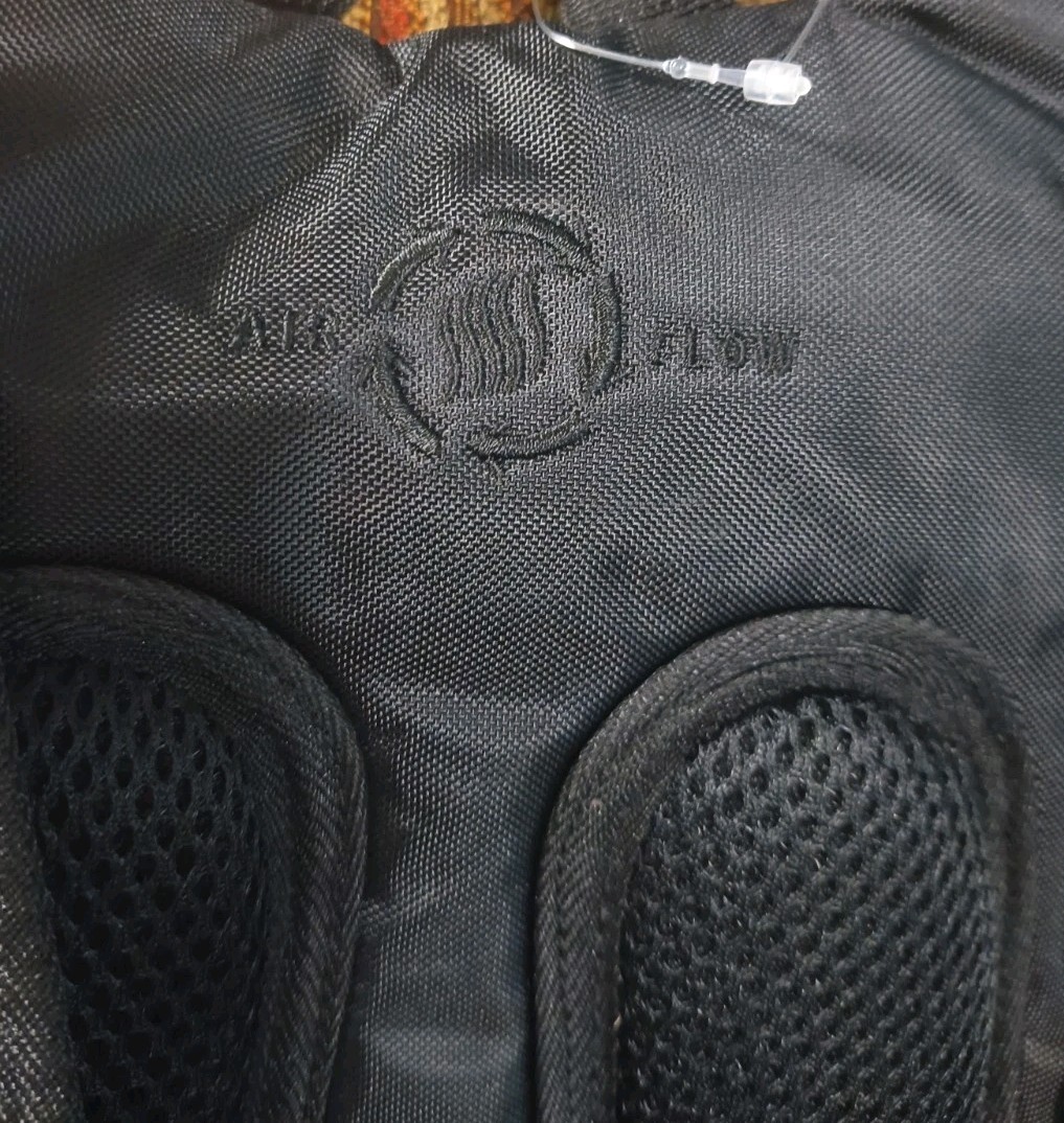 High Sierra lightweight hiking hydration pack customized with a blue Optum Logo