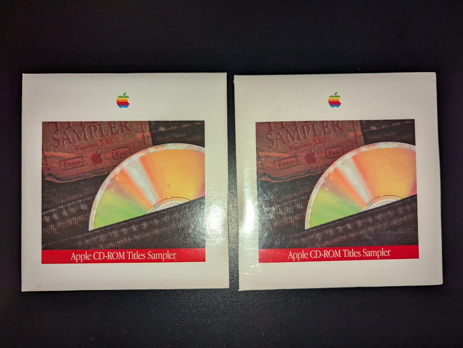 2x Apple CD-ROM Titles Sampler - one shrinkwrapped, one open