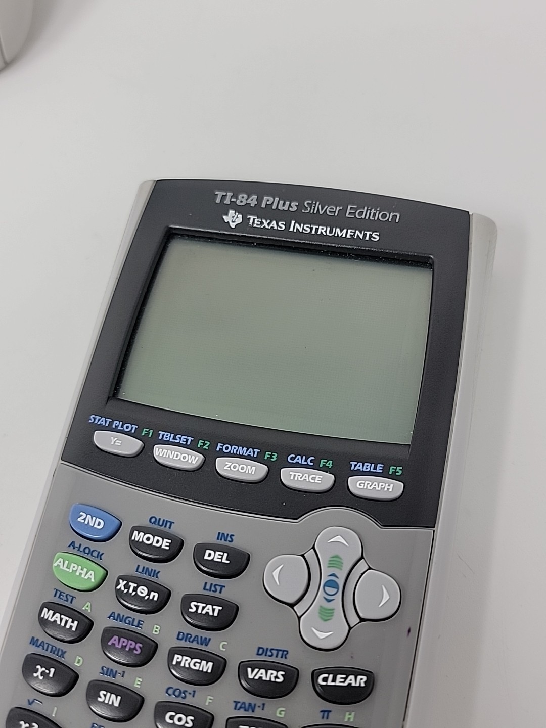 Texas Instruments TI-84 Plus Calculator Silver Edition with cover