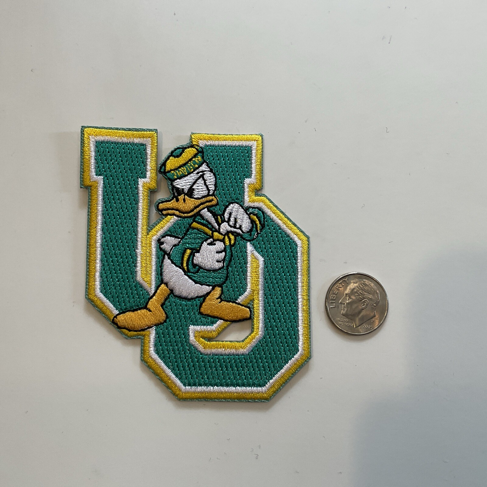 The University Of Oregon DUCKS  Vintage Embroidered Iron On Patch  3” X 2”