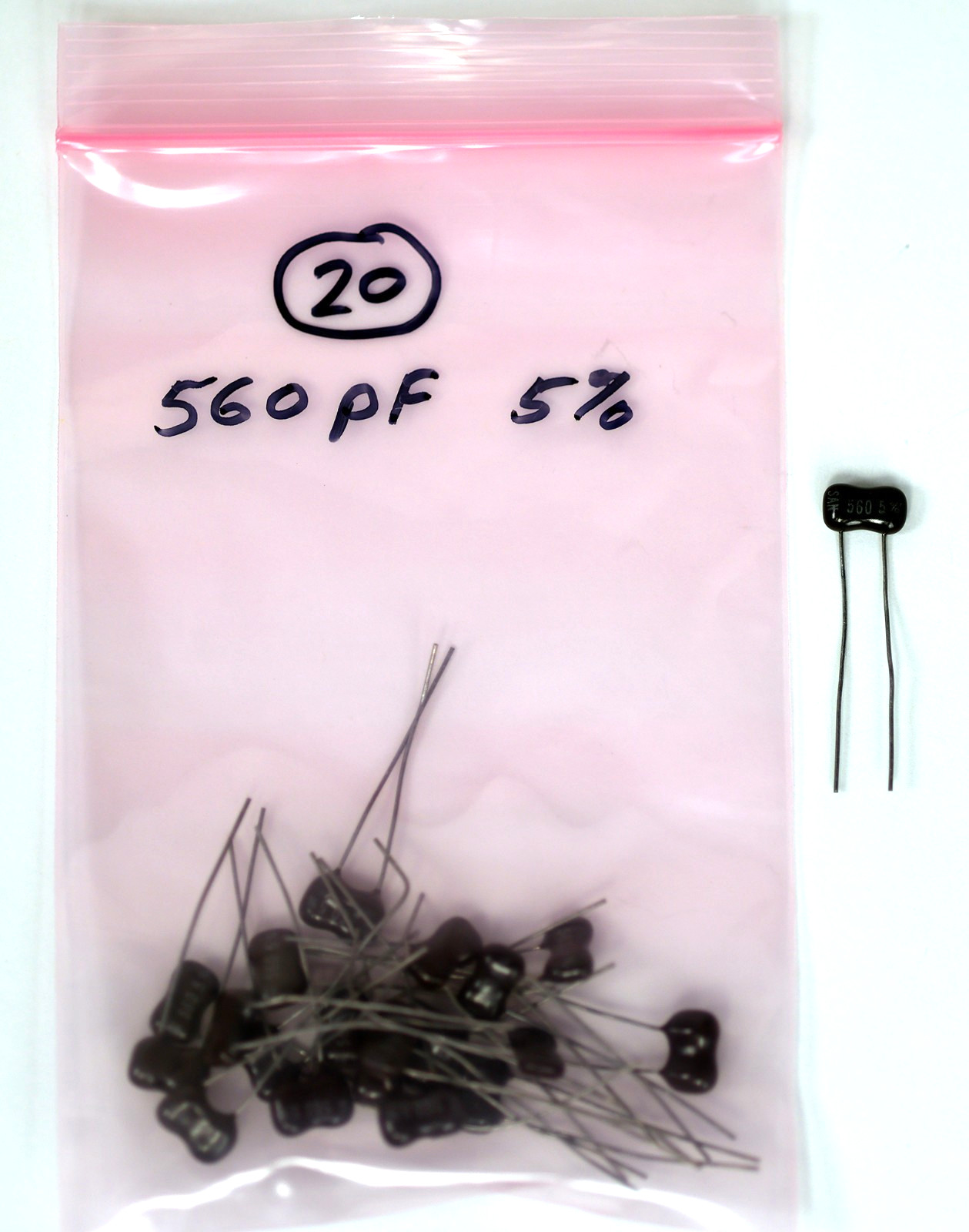 Qty 20: 560pF 500V 5% dipped silver mica radial lead capacitors