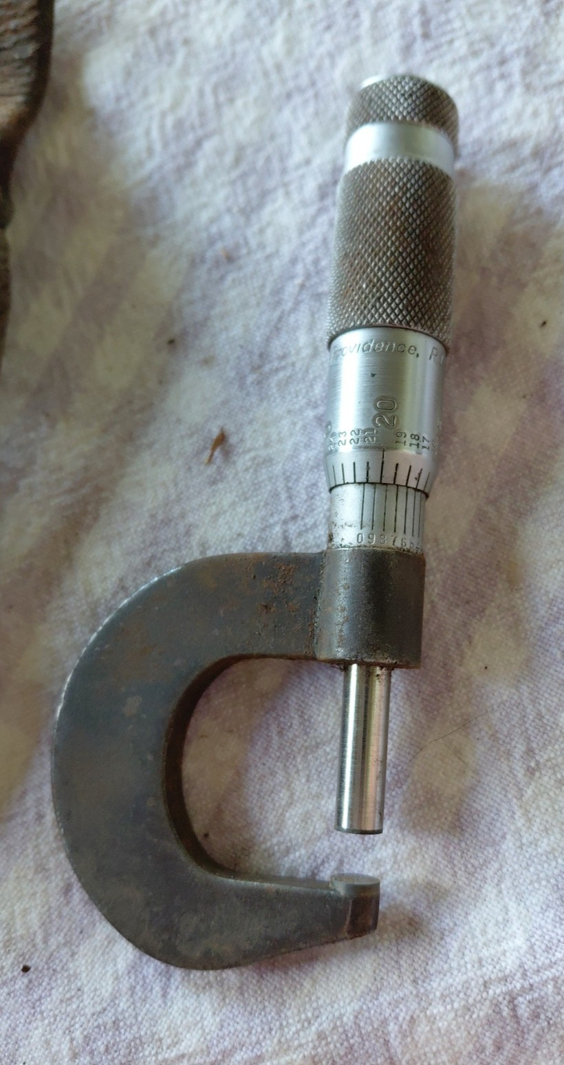 brown sharp micrometer and leather pouch