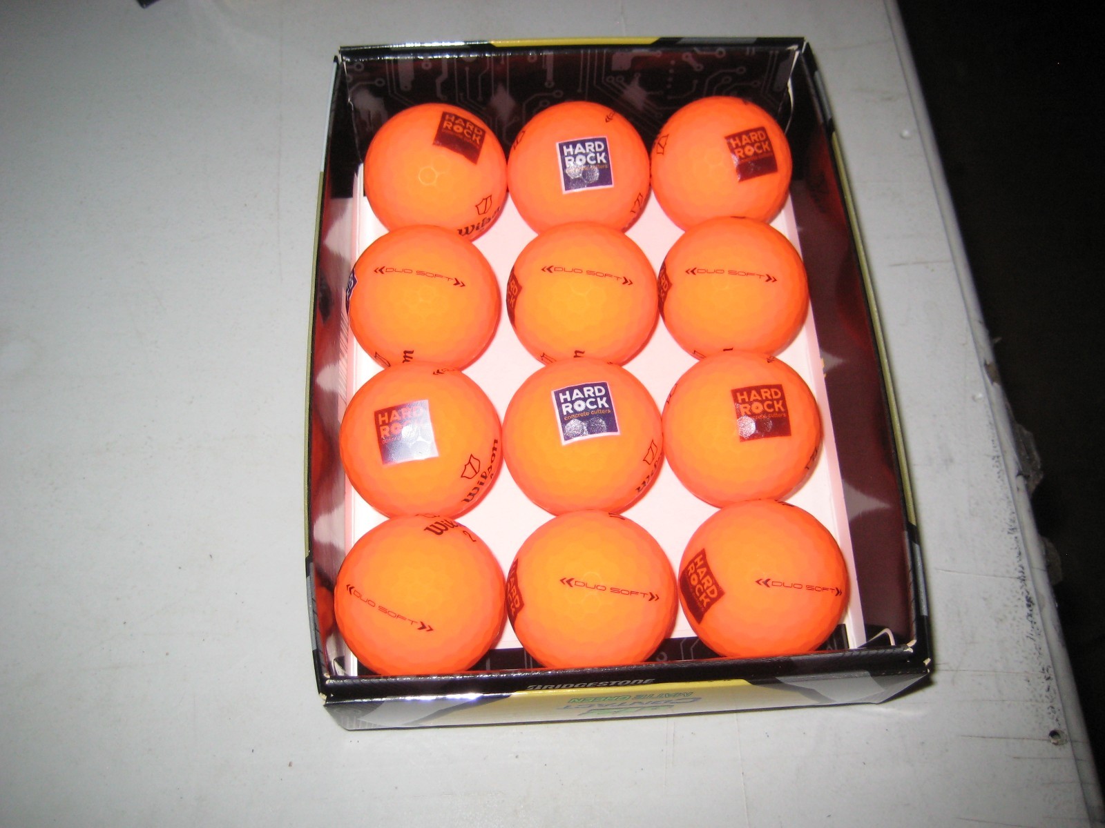 2 dozen BRAND NEW  Wilson Staff Duo Soft  golf balls  Orange   Hard Rock  Logo