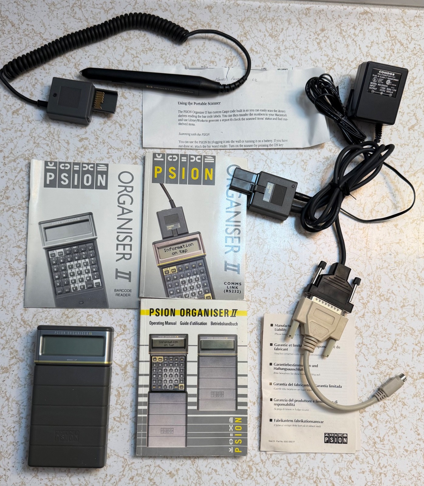 Psion Organiser II  with powered comms link cable/charger 8K data pack