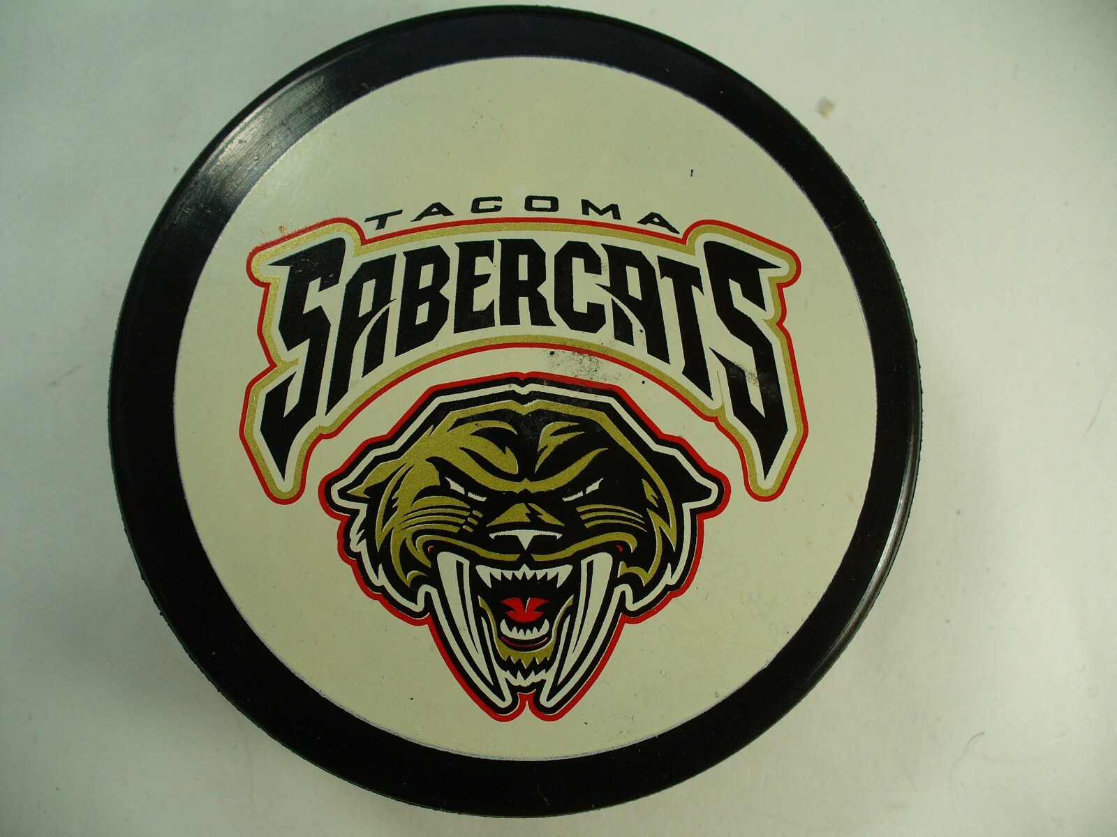 WCHL Tacoma Sabrecats Rare 76 Advertisment Back Logo Hockey Puck Defunct League