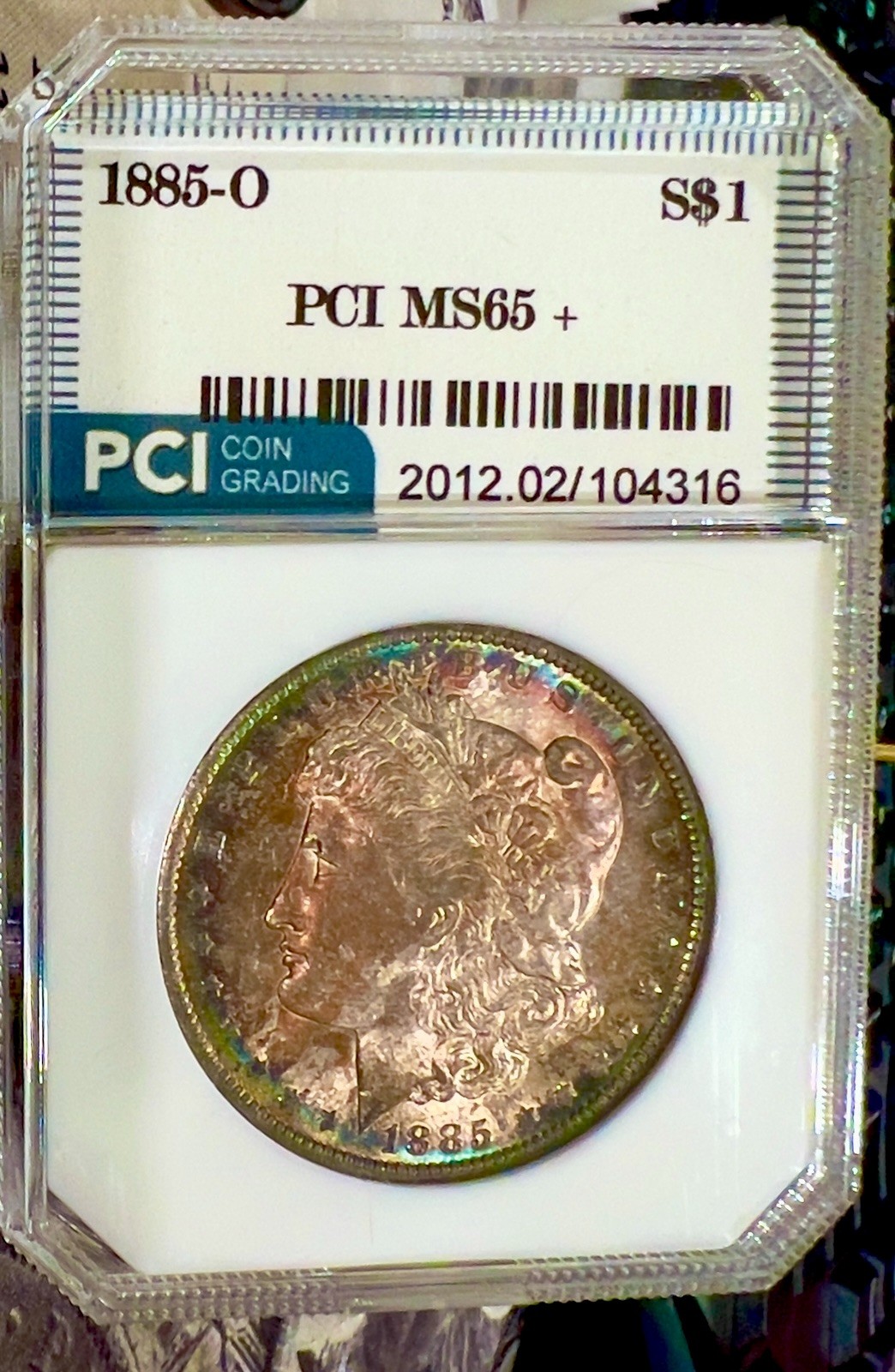 1885 O Morgan Dollar  TONED PCI SLABBED 65 MINT STATE