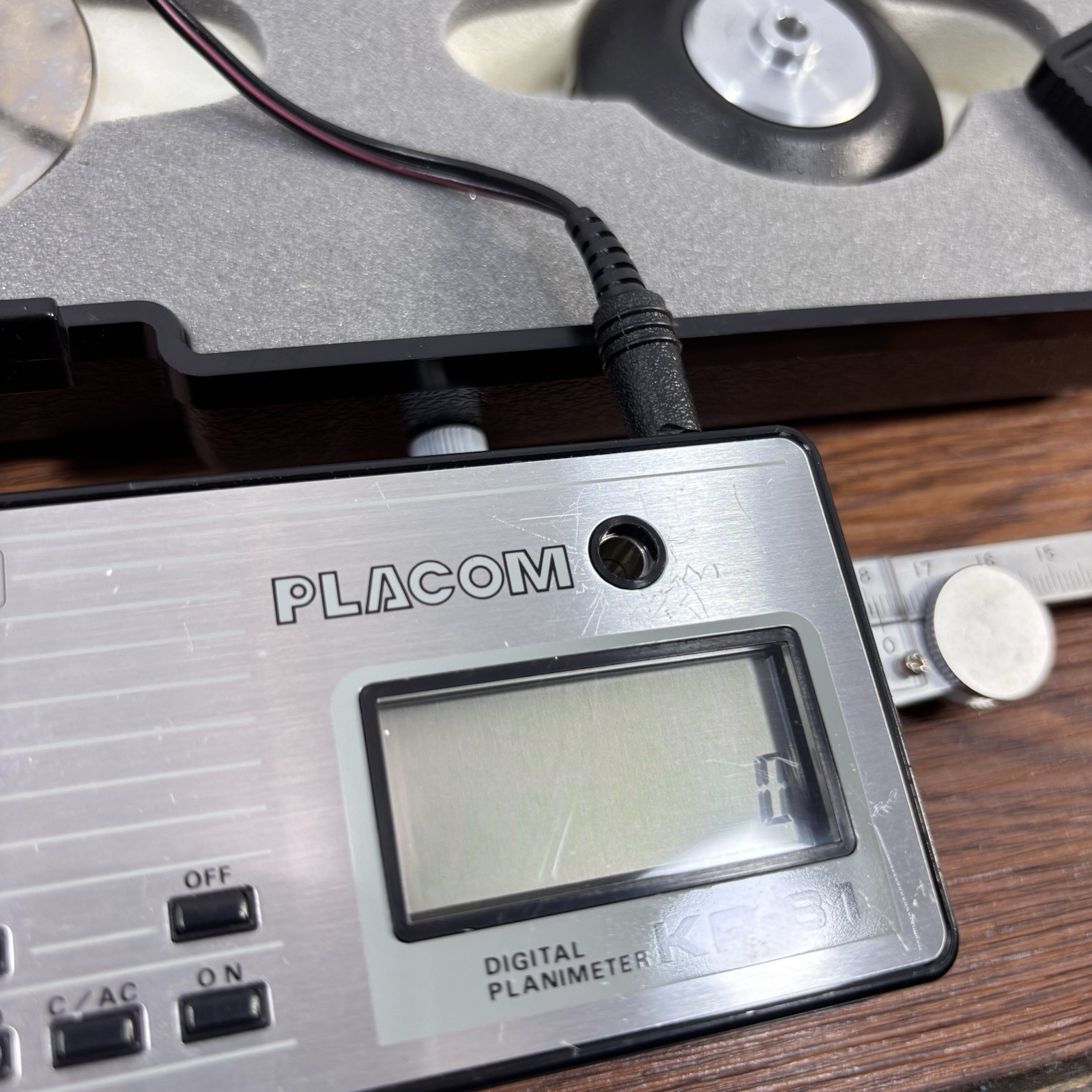 Placom Digital Planimeter Model KP-81, Hard Case, Power Adapter, & Manual