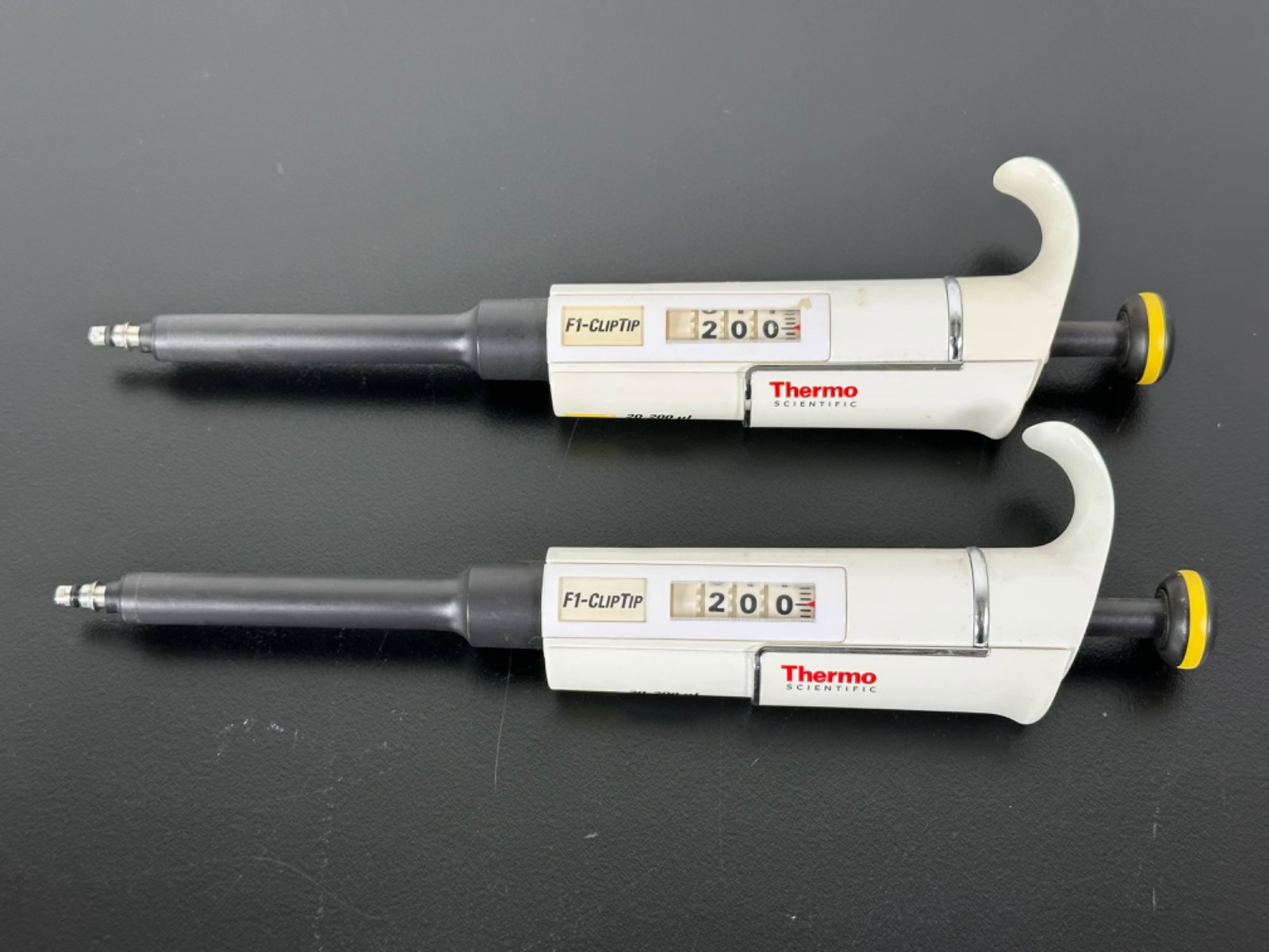 Lot of 2 Thermo Scientific F1-ClipTip 20-200uL Adjustable Pipettes
