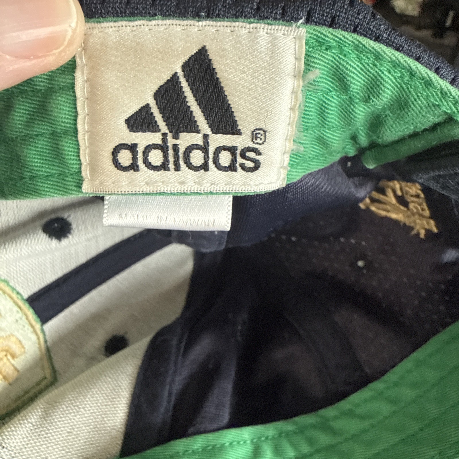 Notre Dame ND Gold Letters on Green Shield on Navy Adidas Hat Cap Hook Loop