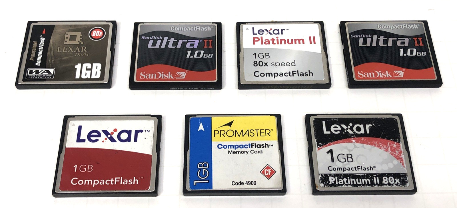 SEVEN ASSORTED 1GB COMPACT FLASH MEMORY CARDS