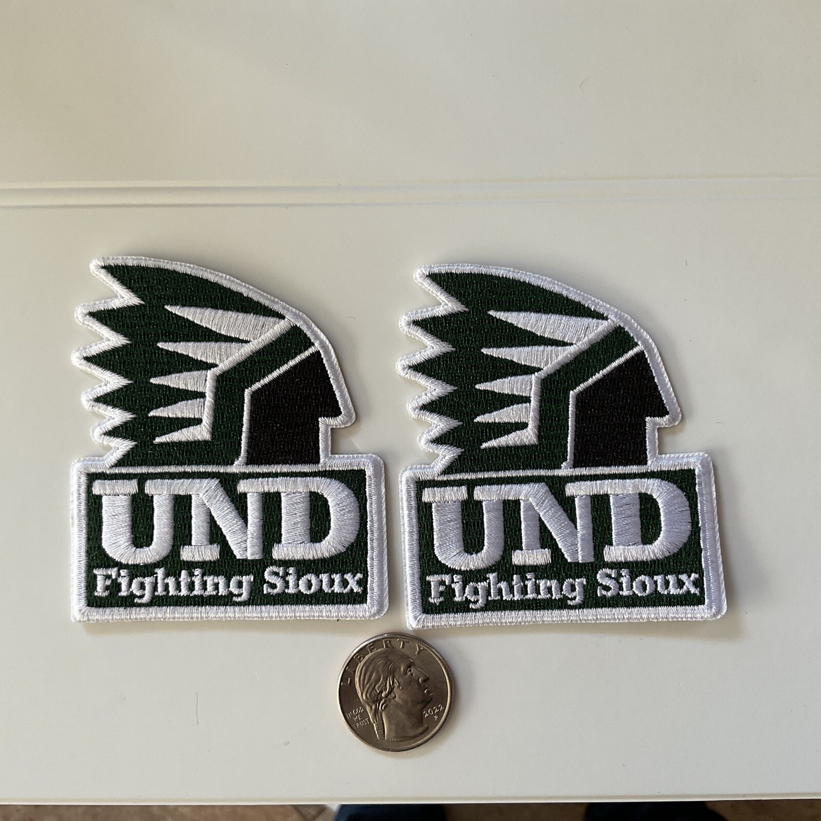 (2) UND University of North Dakota Fighting Sioux iron on embroidered patch lot