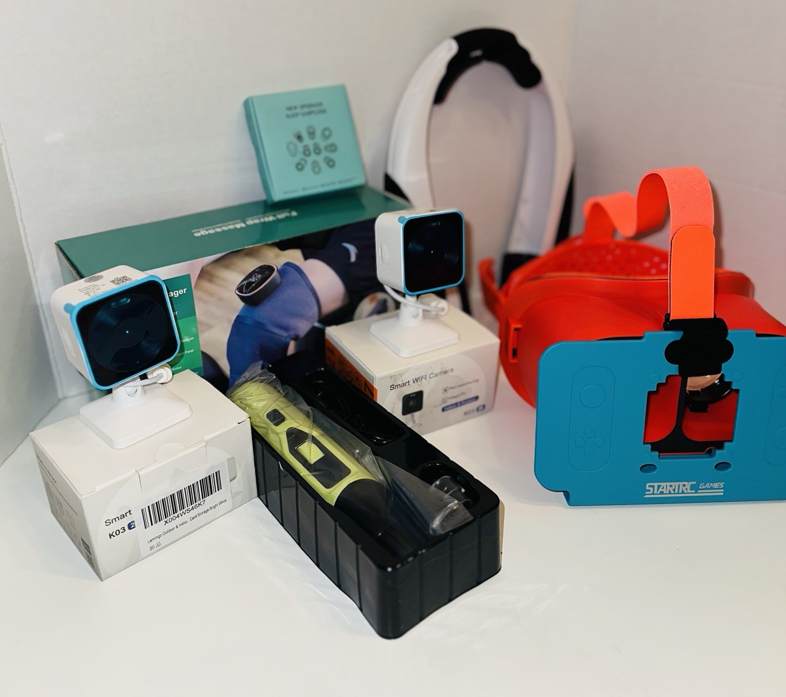 BUNDLE Gadgets: 2 Smart WiFi Cameras, Switch VR Headset, Leg Massager, Earplugs