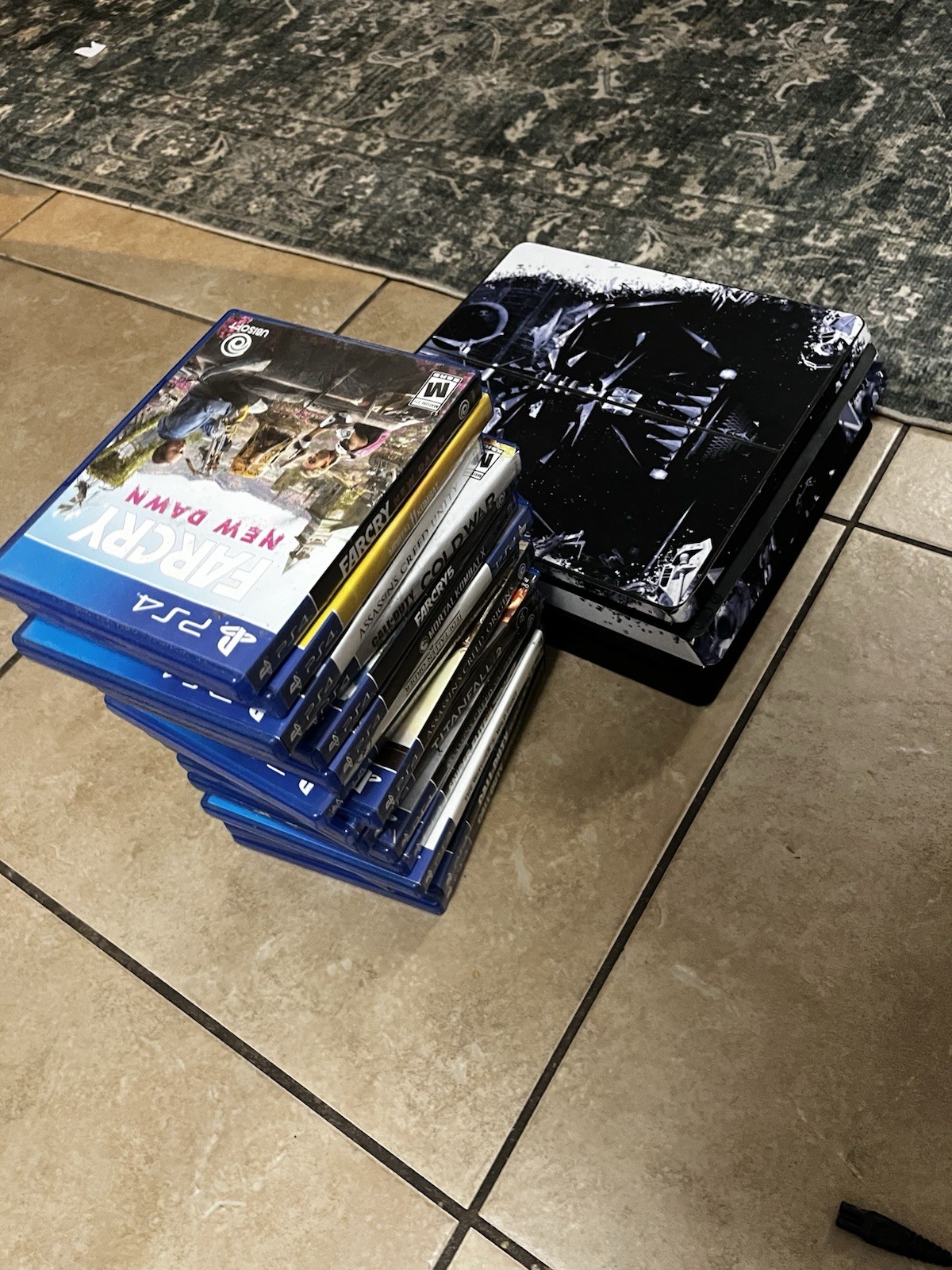 PlayStation 4 console, power cord, HDMI cord, 1 controller, and 17 games