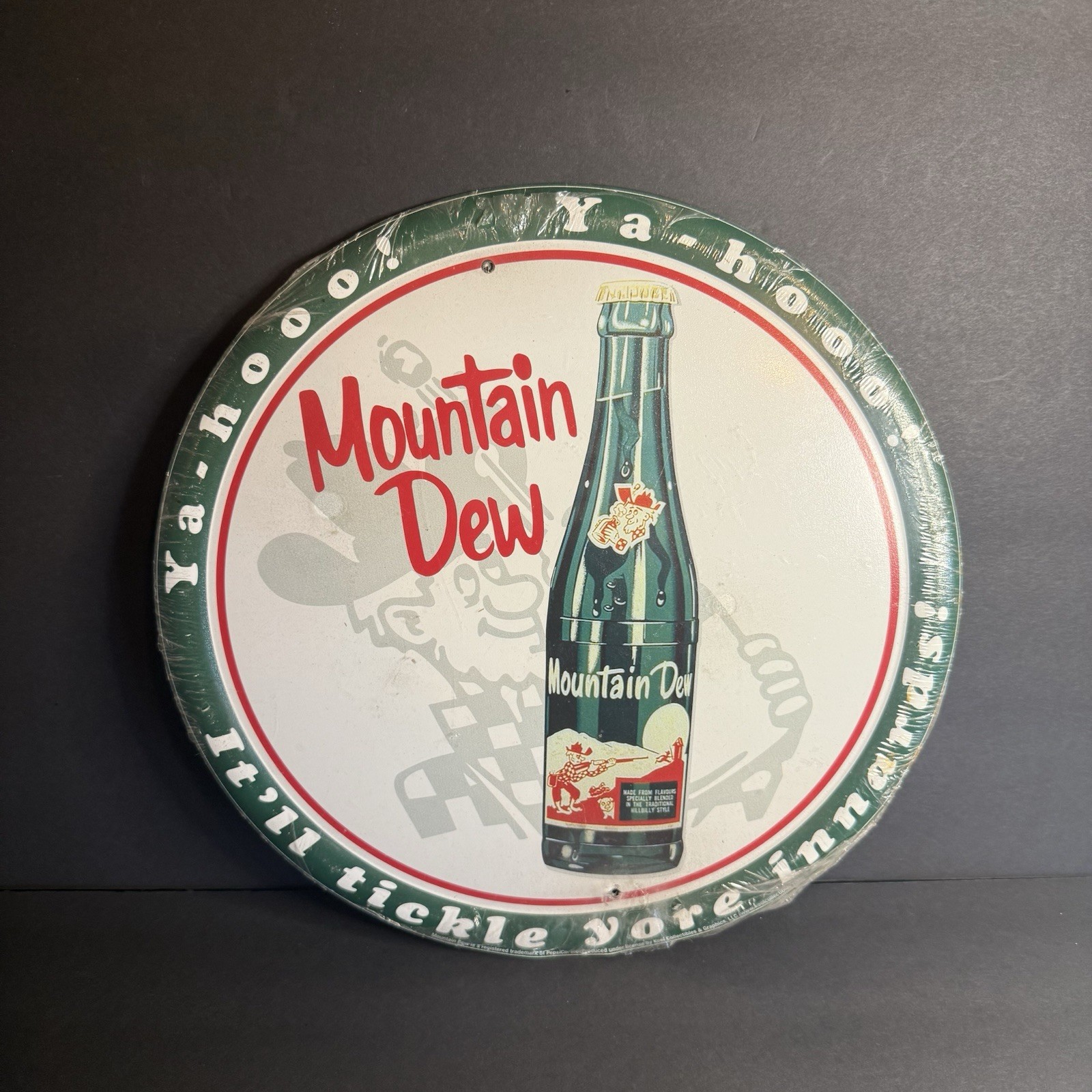 2 Round Tin Mountain Dew Signs