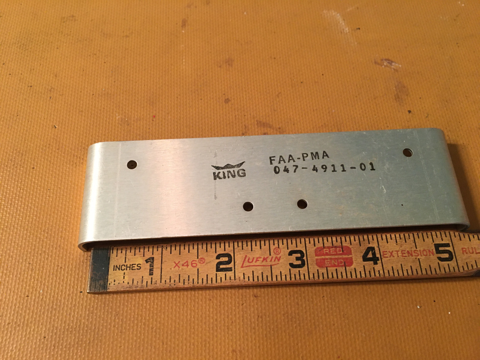 King Radio Small Part:  Plate 047-4911-01 aka 047-04911-0001