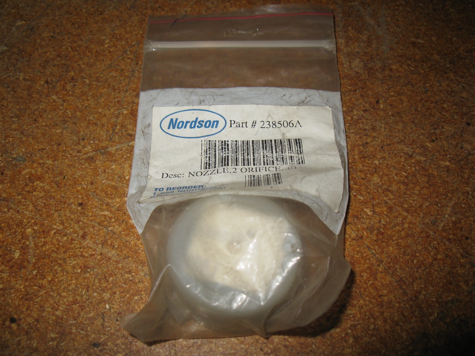 NORDSON NOZZLE, 2-ORIFICE, .012" DIA @ 30 DEGREE, 238506A