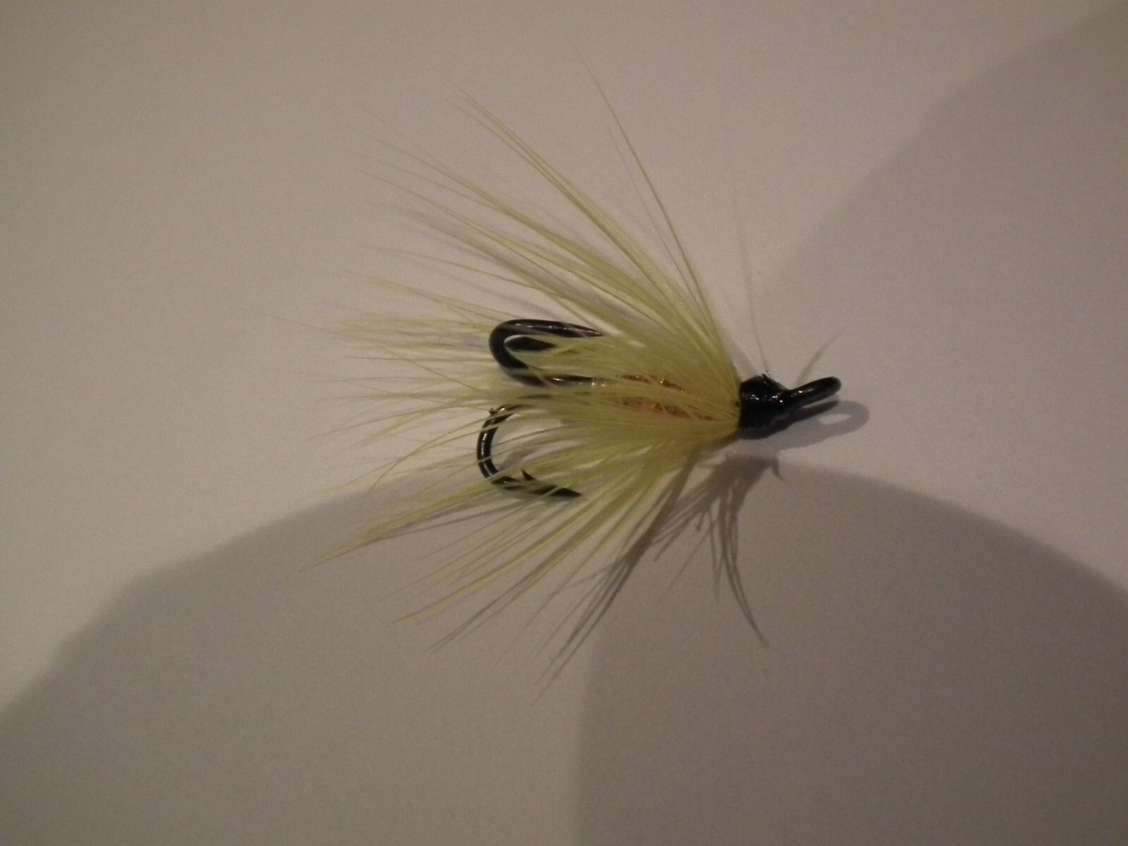salmon/seatrout fly----1 yellow & orange tied on a black size 14 treble