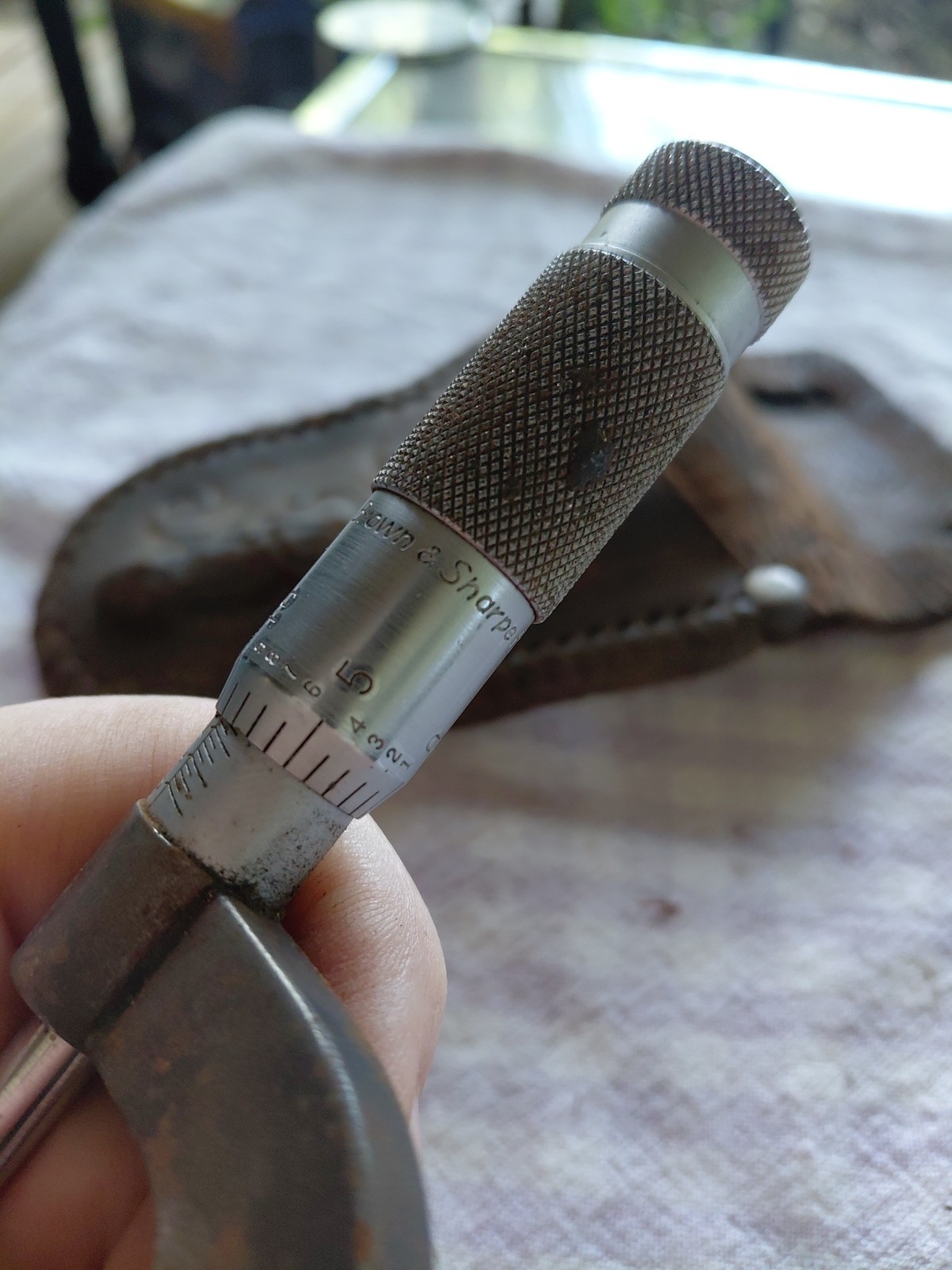 brown sharp micrometer and leather pouch