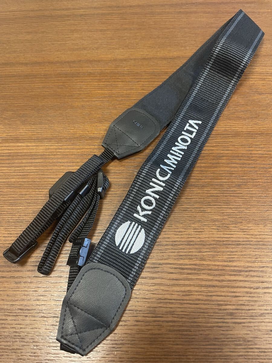 Konica Minolta camera strap black with white embroidered lettering unused