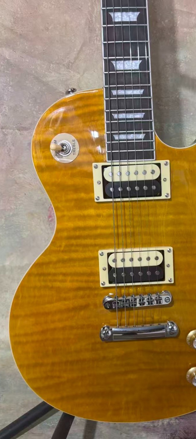 A very beautiful electric guitar, with yellow on the front and red on the back