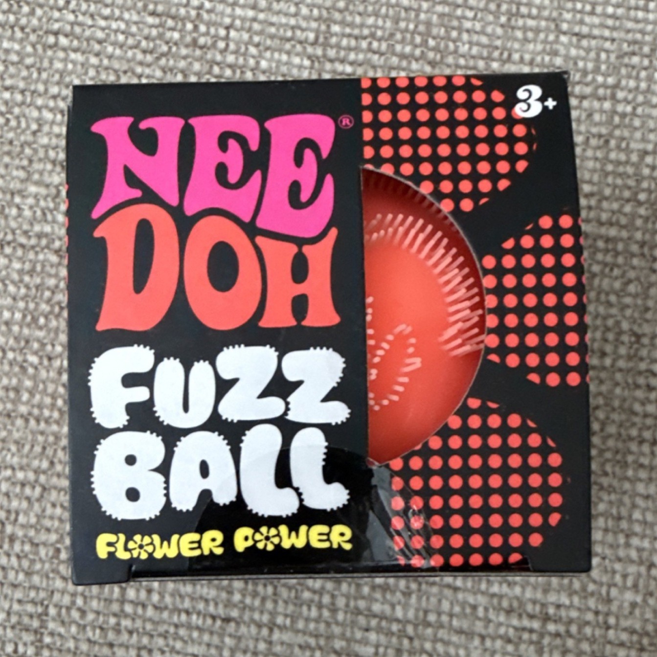 Nee Doh orange Fuzz Ball Flower Power Squeeze Ball Velvety Texture