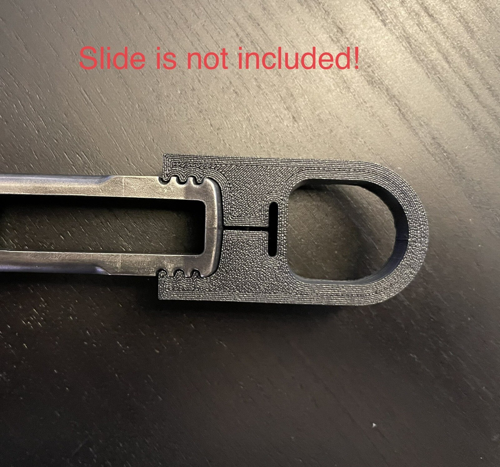 Smith & Wesson model 22A finger loop charger, slide racker.