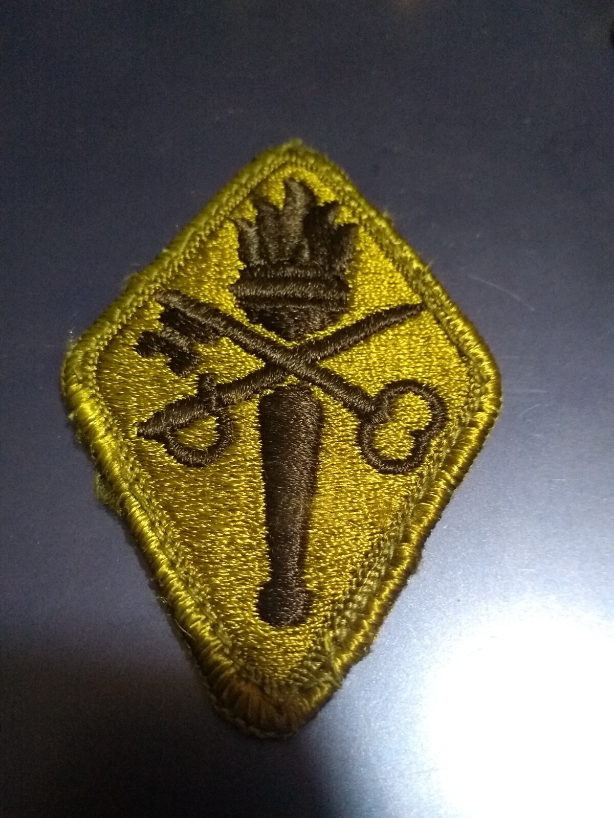 U.S. Army Shoulder Sleeve Insignia-Subdued Quartermaster Training Center(23-056)