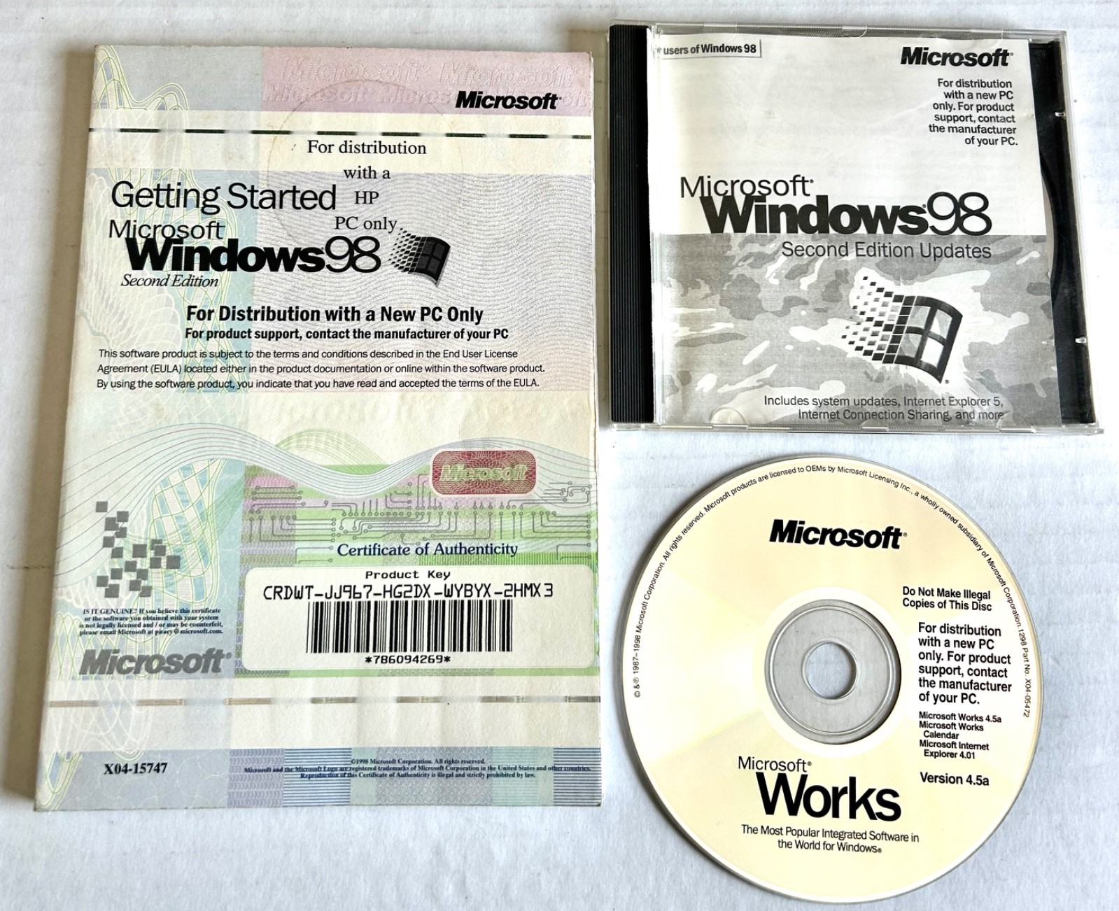 3 Microsoft Items:  Windows 98 Disk&Manual 2nd Ed and Microsoft Works 4.5a disk