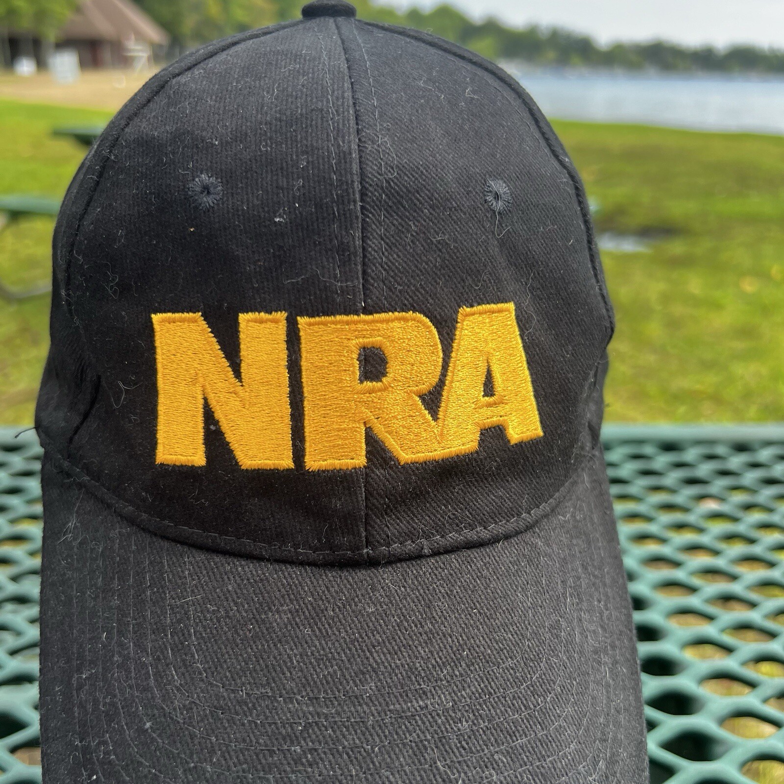 NRA Gold Letters on Black Hat Cap w Gold Bill Edge Hook Loop American Flag EUC