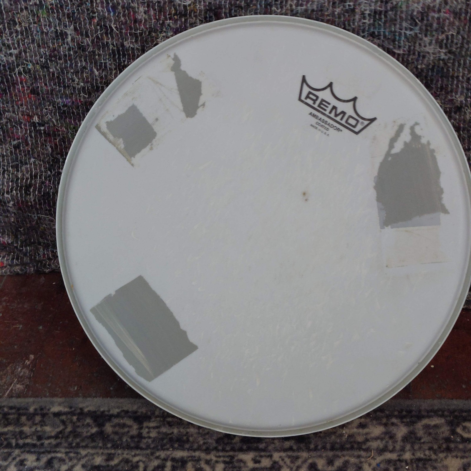 Used Remo Ambassador Coated 12" Drum Head with Tape Marks
