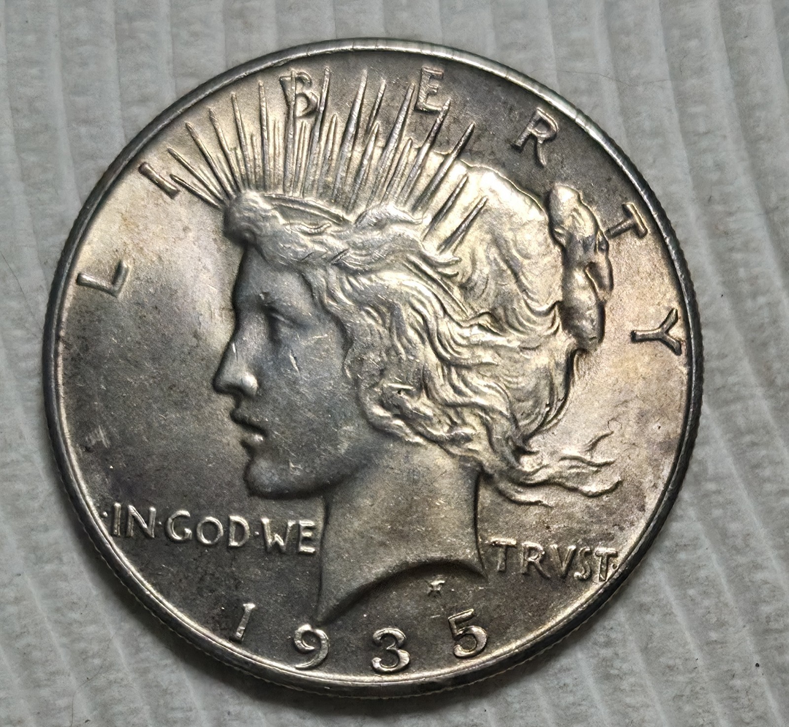 1935 P Peace Silver Dollar. Estimated Almost Uncirculated 58. A0989.