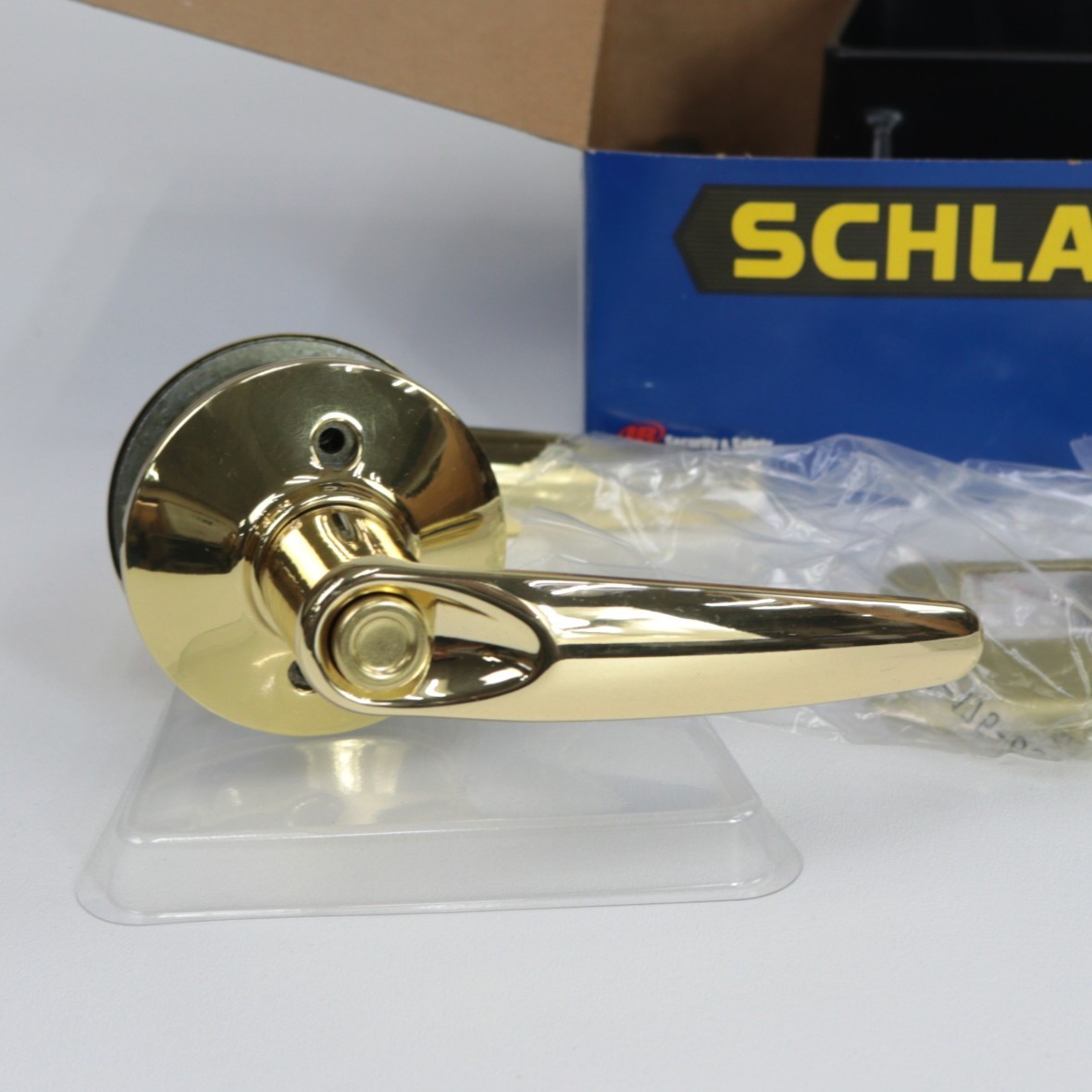 Schlage Jazz Reversible Privacy Lock Lever Set in Polished Brass F40 JAZ 605