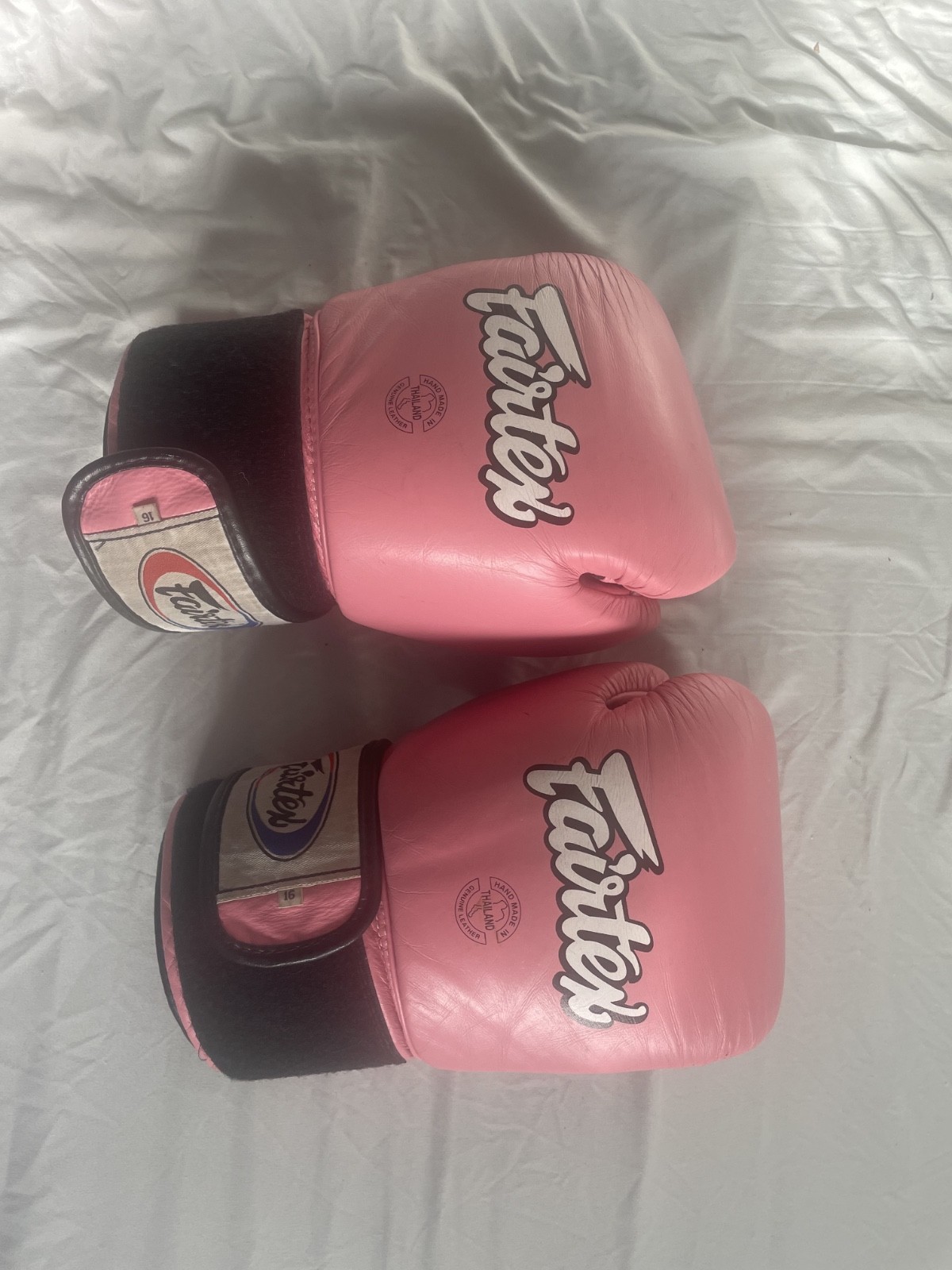 Pink Fairtex Gloves 16 oz. Used condition. Made in Thailand