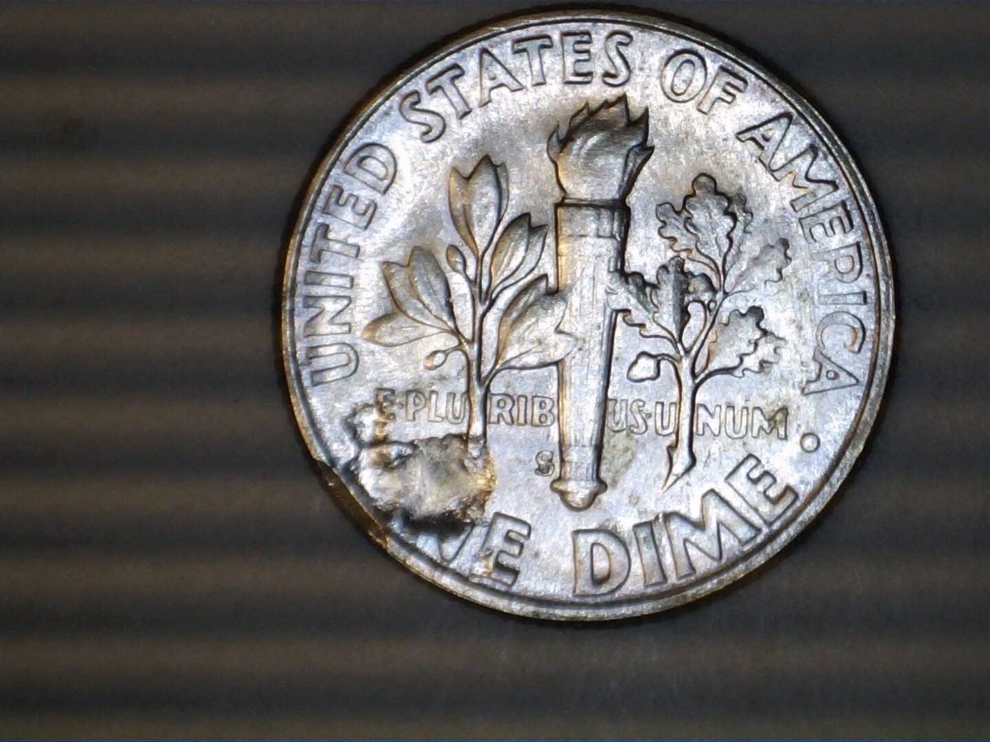 1955s Bu Roosevelt dime Error cracked planchet reverse
