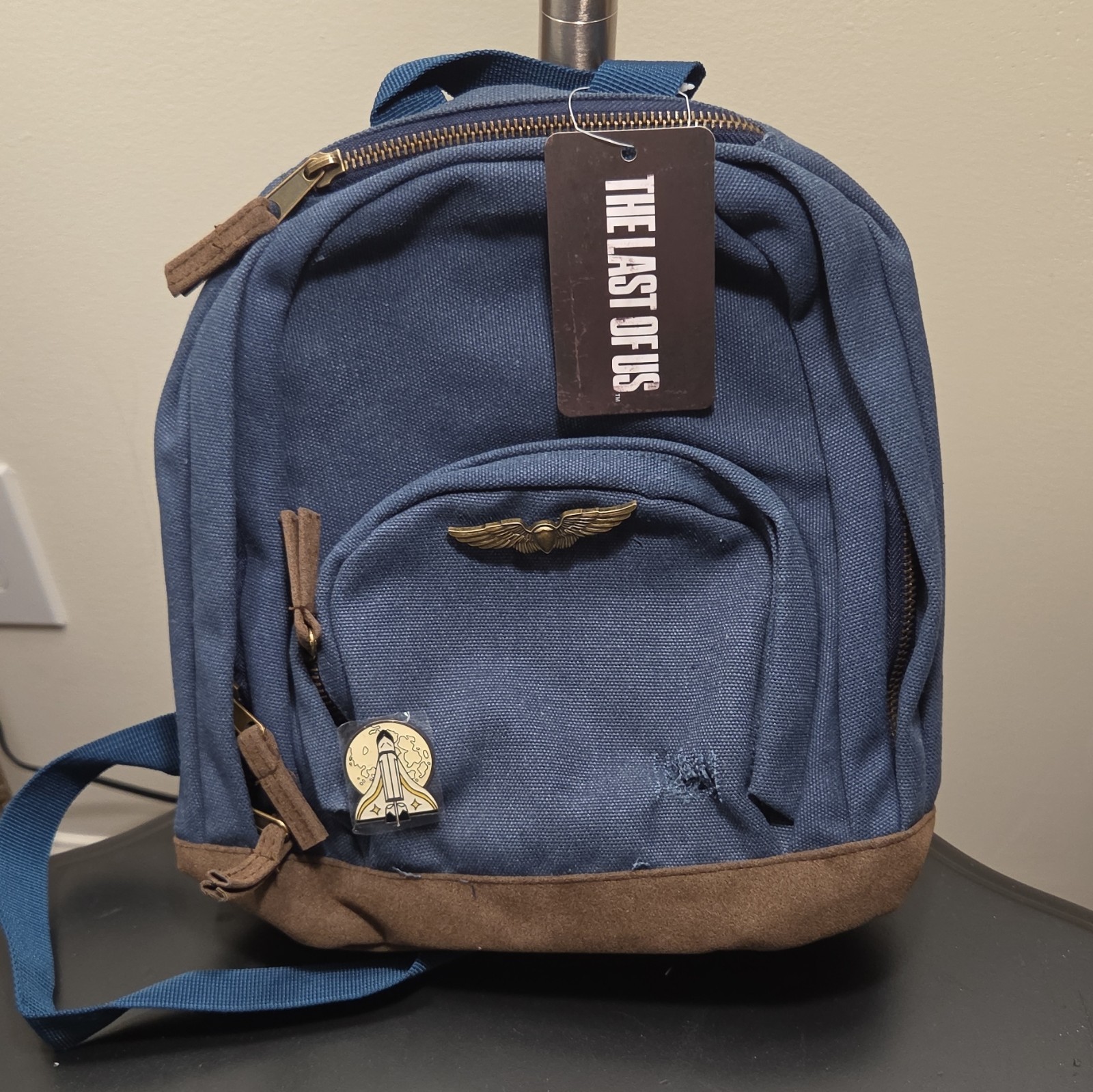 The Last of Us Video Game Series Blue Backpack Bag with Front Zip Pocket